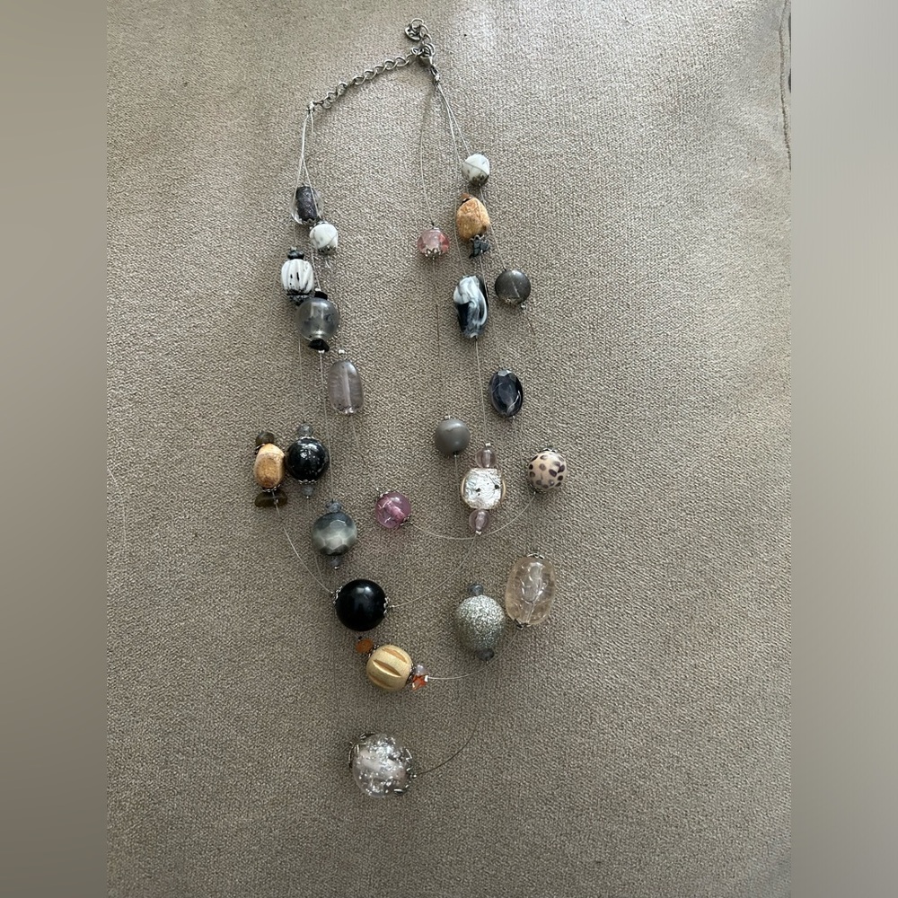 Floating bead necklace with beads on wire